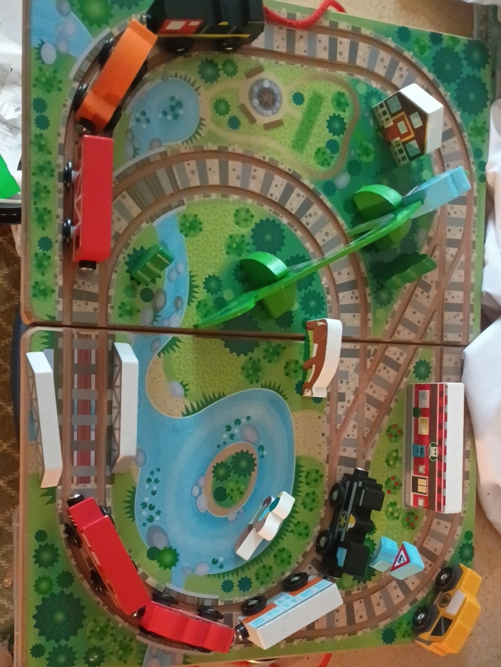 Melissa & Doug Wooden Train Playset with 4 additional trains.